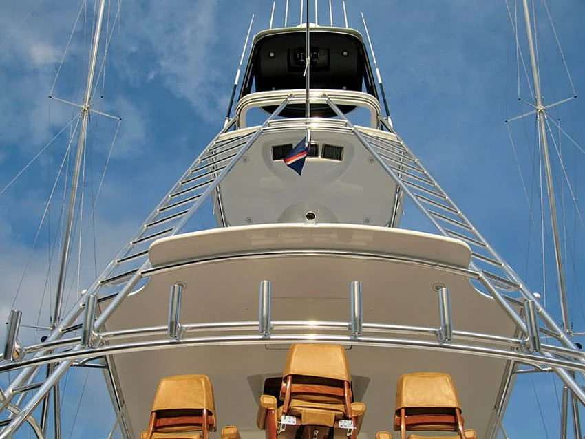Fighting chairs and tower of a game boat against blue sky
